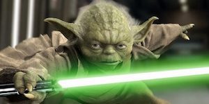 Yoda holding Green Lightsaber