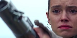 Rey Holding Lightsaber