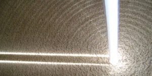 White Lightsaber Pointed in Sand